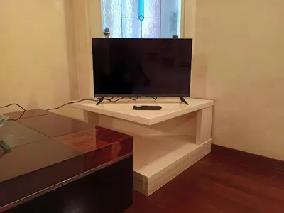 a tv sitting on a white table in a room at Milizie Vintage in Rome