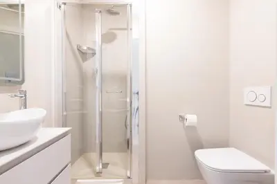 a shower in a bathroom with a toilet and a sink at Elegant Flat in Ponte Milvio in Rome