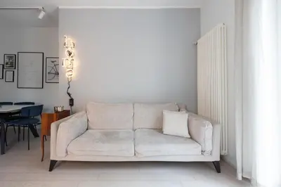 a living room with a couch and a table at Elegant Flat in Ponte Milvio in Rome