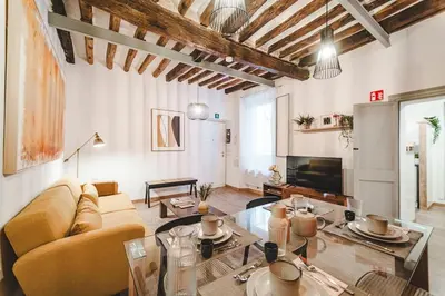 a living room with a couch and a table at Fancy Colosseum - Best location in Rome