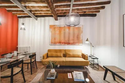 a living room with a couch and a table at Fancy Colosseum - Best location in Rome