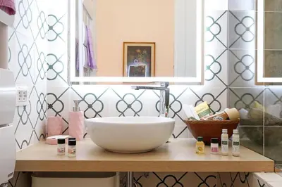 a bathroom with a large white bowl sink on a counter at Walking in the center of Rome in Rome