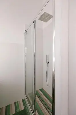 a shower with a glass door in a bathroom at Walking in the center of Rome in Rome