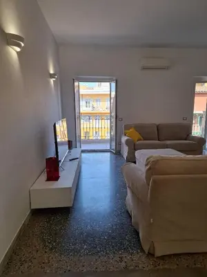 a living room with a couch and a tv at Monti View Apartment in Rome