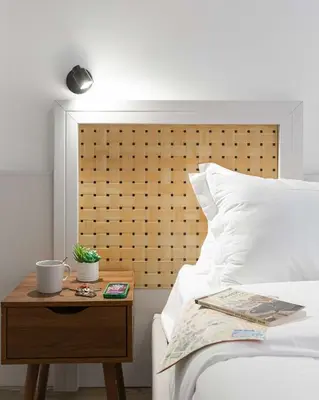 a bed with a night stand next to a table with a bed sidx sidx sidx at Rental in Rome Guest House 2-ZEN51 in Rome