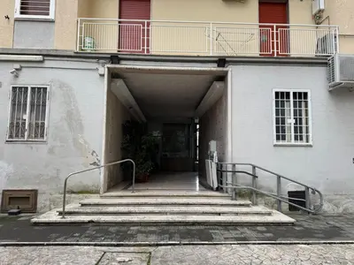 a stairway leading to a building with a balcony at Piramide-Ostiense Two Bedroom Apartment in Rome