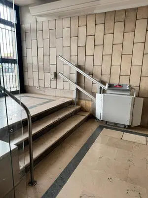 a set of stairs in a building with a machine at Piramide-Ostiense Two Bedroom Apartment in Rome