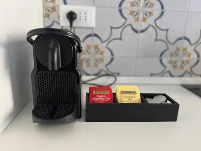 a black coffee pot sitting on a counter next to a box at Piramide-Ostiense Two Bedroom Apartment in Rome