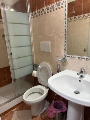a bedroom with a bed with a black and white comforter at GranRoma in Rome