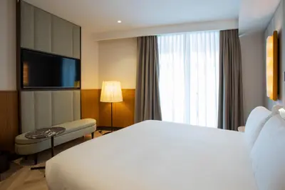 a hotel room with a bed and a television at Circle6 Rome in Rome