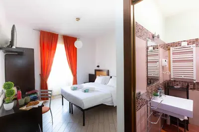 a bedroom with a bed and a sink in it at Rental in Rome Guest House - ZEN01 in Rome