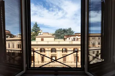 a window with a view of a building at Rental in Rome Guest House - ZEN01 in Rome