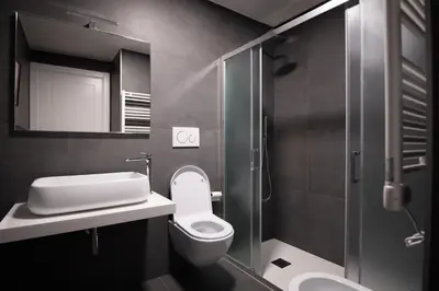 a bathroom with a toilet and a sink and a shower at Labicant Casa Vacanze Roma in Rome