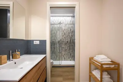 a bathroom with a sink and a shower at Aurelius Design Loft 1 in Rome