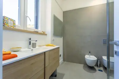 a bathroom with a sink and a toilet at Elegance and Style near St Peter's in Rome