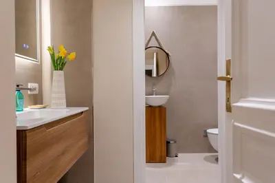 a bathroom with a sink and a mirror at Elegance and Style near St Peter's in Rome