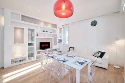 a white living room with a white table and chairs at Elegant Apartment near the Centre - Wi-Fi & Netflix Free in Rome