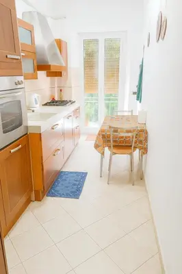 a kitchen with a table and a dining room at Hi HOME in Rome