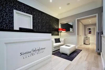 a store front of a living room with a couch at Sistina Twentythree luxury rooms in Rome