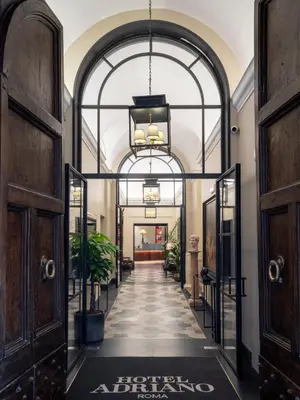 an entrance to a fashion store with an archway at HOTEL ADRIANO Rooftop in Rome