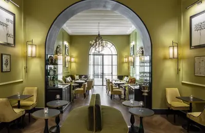 an archway in a restaurant with tables and chairs at HOTEL ADRIANO Rooftop in Rome