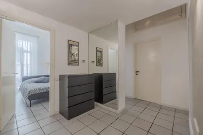 a bedroom with a mirror and a bed in it at Vibrant Trastevere 2 bedrooms on Via del Moro in Rome