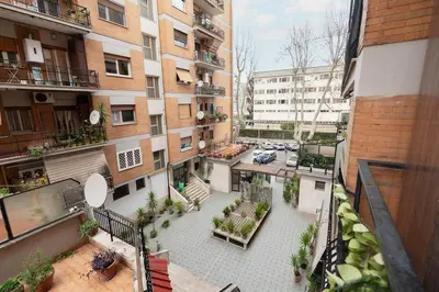an overhead view of a courtyard in an apartment building at Garbatella Appartamento Moderno Relax e Comfort in Rome