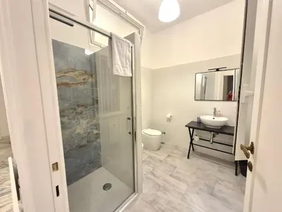 a bathroom with a shower and a sink at Edo's Rhome in Rome