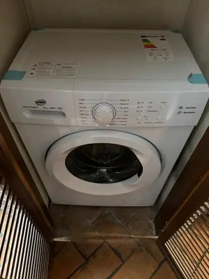 a microwave oven sitting on a counter with a checkered floor at Borgo in Elegante appartamento in Rome