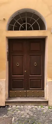 a white washing machine sitting on top of a floor at Borgo in Elegante appartamento in Rome