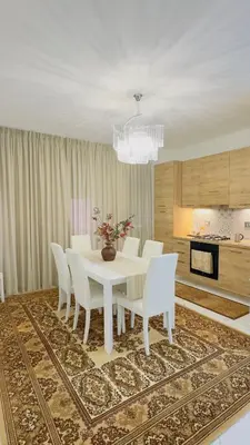 a dining room with a white table and white chairs at Marconi House - A un passo da Trastevere in Rome