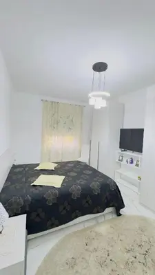 a bedroom with a bed with a black blanket at Marconi House - A un passo da Trastevere in Rome