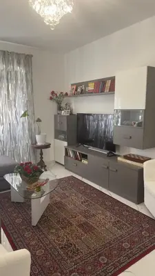 a living room with a couch and a television at Marconi House - A un passo da Trastevere in Rome