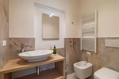 a bathroom with a sink and a toilet at Cipro Vatican Luxury Escape in Rome