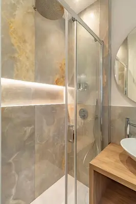 a shower with a glass door in a bathroom at Cipro Vatican Luxury Escape in Rome