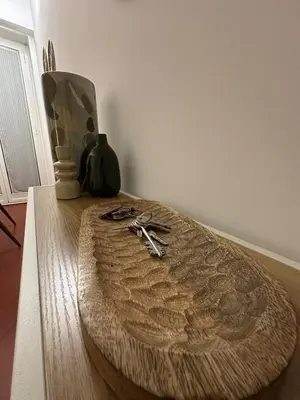 a table with scissors on top of a wooden floor at 'Boh House' in Rome