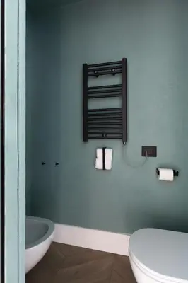 a bathroom with a toilet and a sink and a mirror at Navona - Luxury, design and Jacuzzi style in Rome