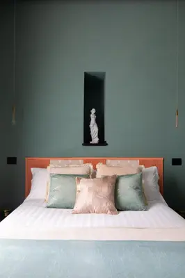 a large bed with white sheets and pillows at Navona - Luxury, design and Jacuzzi style in Rome