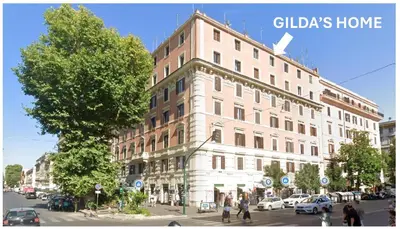 a large building on the corner of a city street at Gilda's Home in Rome