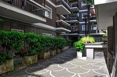 a walkway in front of a building with plants at Moletta 17 in Rome