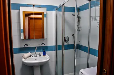 a bathroom with a sink and a shower at Moletta 17 in Rome