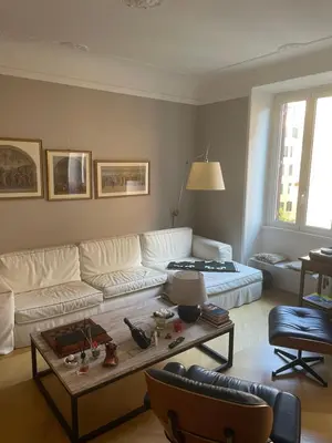a living room with two chairs and a large television at Ciambix Home Roma Vatican in Rome