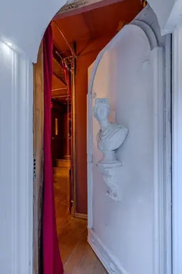a hallway with a vase on the wall at Villino Ermes Campanelli in Rome