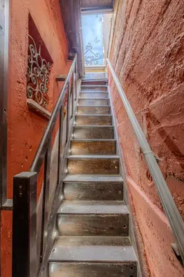 a stairway leading up to a building at Villino Ermes Campanelli in Rome