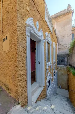 an entrance to a building with a red door at Villino Ermes Campanelli in Rome