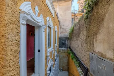an entrance to a building with a red door at Villino Ermes Campanelli in Rome