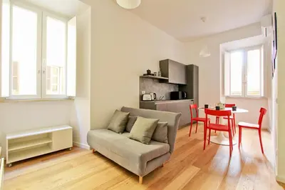 a living room with a couch and a table at La Casa di Chantal in Rome