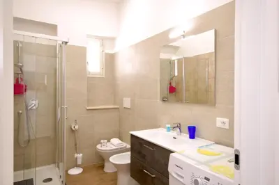 a bathroom with a sink and a shower and a toilet at HC - Piazza Vittorio Emanuele Dream in Rome