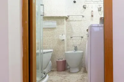 a bathroom with a toilet and a bidet at Domus Caroli in Vaticano in Rome