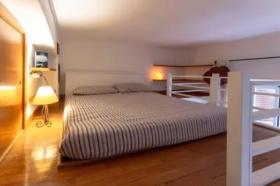 a bedroom with a bed and a bunk bed at Domus Caroli in Vaticano in Rome